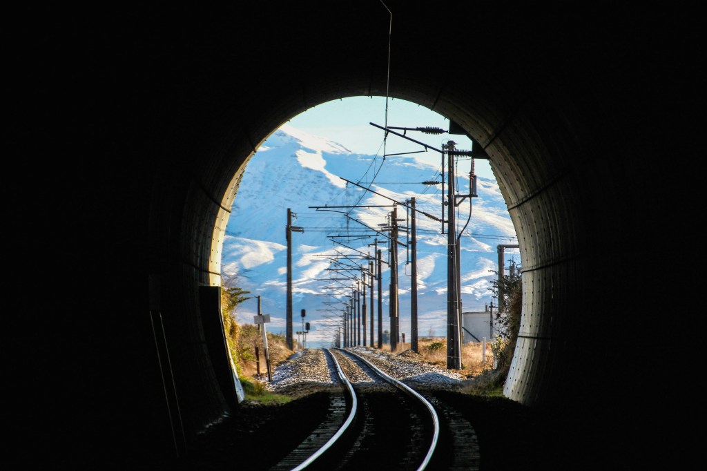 Peering through the rail underpass at Mt Ruapehu. Not much of a risk of being run over by a train in New Zealand.