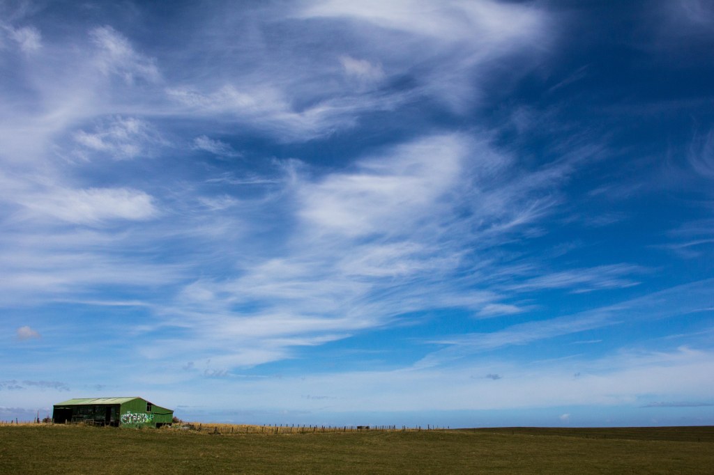 A woolshed, we have lots of them in New Zealand. not so many with graffiti on the side though.