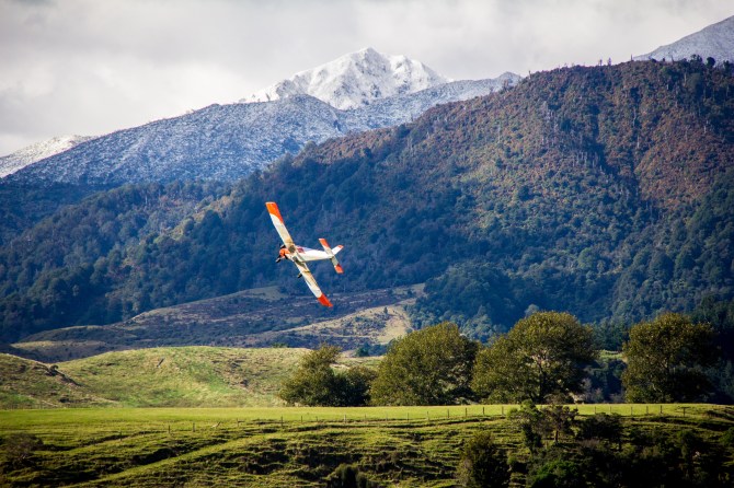 Top Dressing plane in an attractive orange to set to off against the wilderness, like on purpose.
