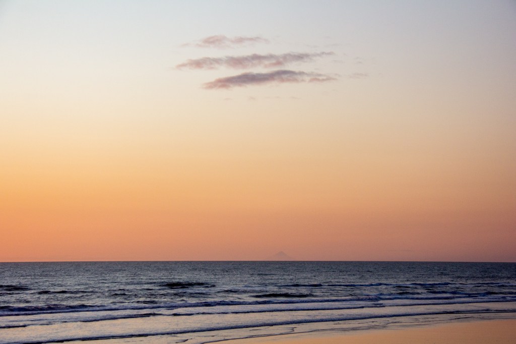 On the horizon, in the distance is Mt Taranaki, 210 Kilometres distant