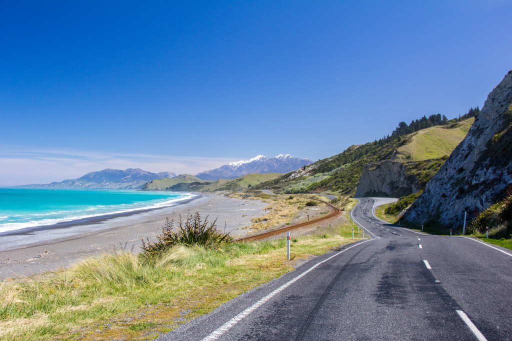 That's New Zealand's main road. State Highway One. The rail line beside it is the main rail route south. This is how we get about. It's nice here.