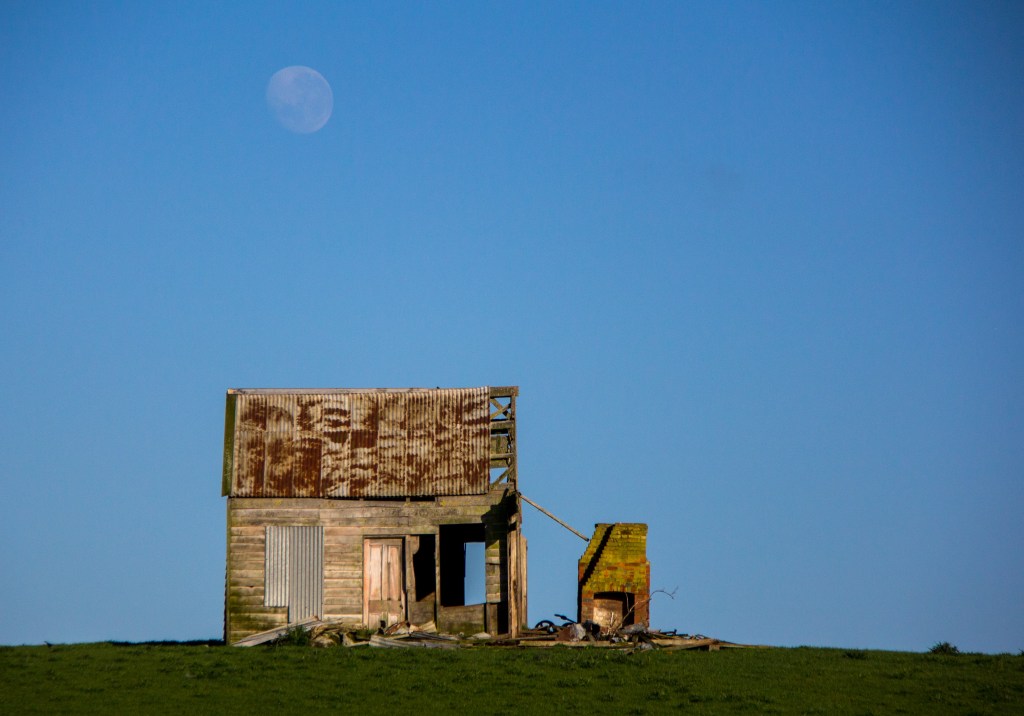 Dawn, early moon in Rangitikei. With a derelict cottage
